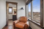 Enjoy views of downtown Whitefish from this cozy seating area in the master bedroom